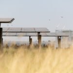 The field of solar panels with an energy storage station located in the middle of a solar cell panel on an area of hundreds of acres